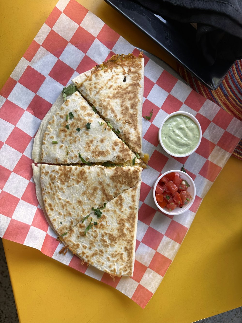 Stock photo of a large quesadilla cut in pieces
